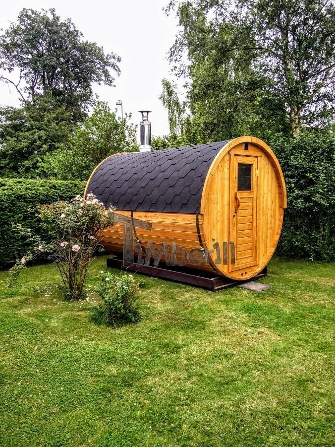 Outdoor barrel sauna in garden Germany
