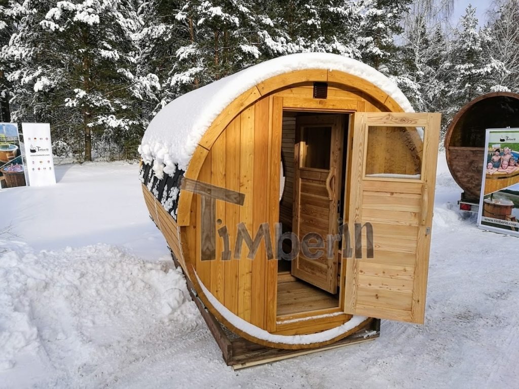 Outdoor barrel sauna with full panoramic window in winter (2)